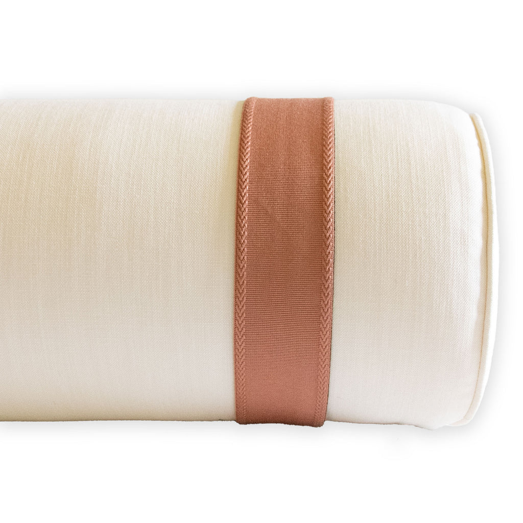 stain resistant ivory performance fabric bolster with inset blush tape trim
